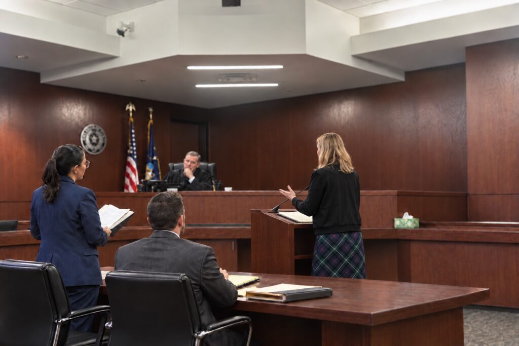 Attorneys address the judge during a magistration hearing in the Travis County CAFA courtroom