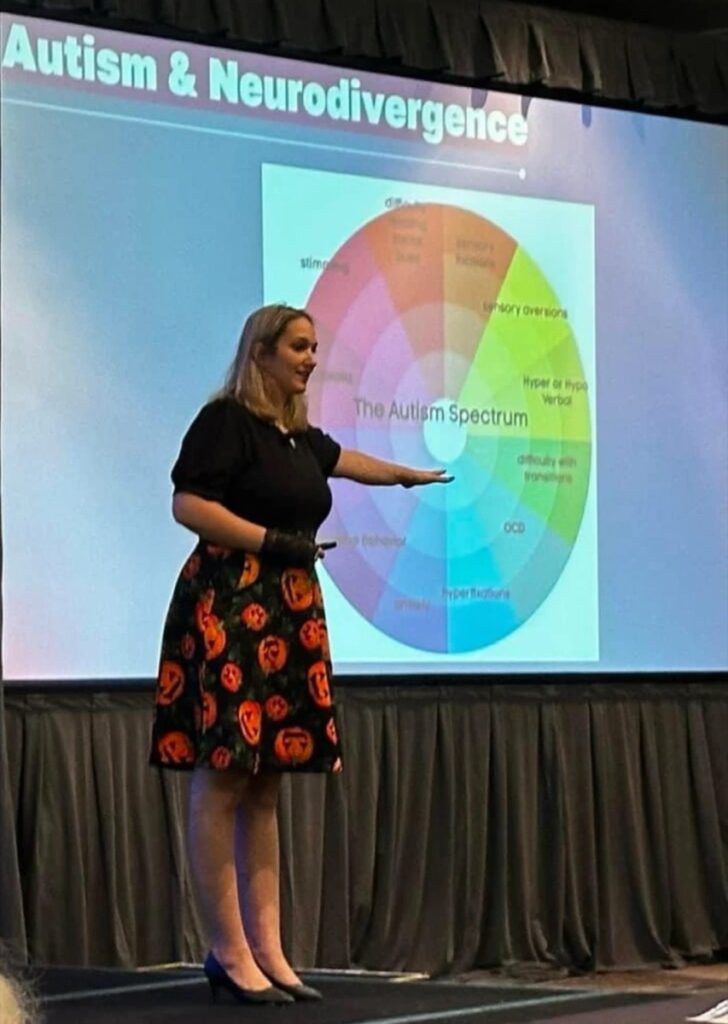 Angelica Cogliano presenting a slide on autism and neurodivergence to criminal defense lawyers